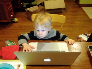 boy playing with laptop